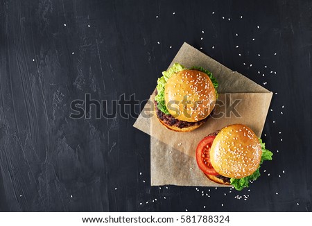 Similar – Foto Bild Leckerer Hamburger mit schwarzem Sesam auf Holztablett