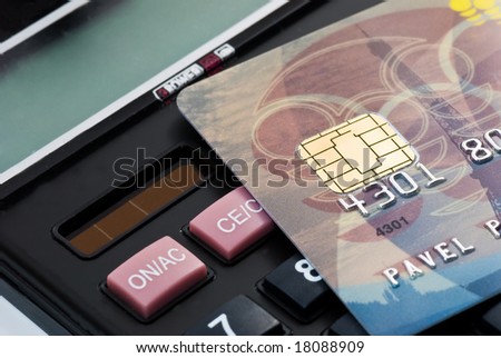 visa chip plastic card over business calculator