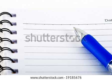 pen over note book