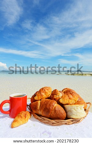 Coffee and breads on the sandy beach