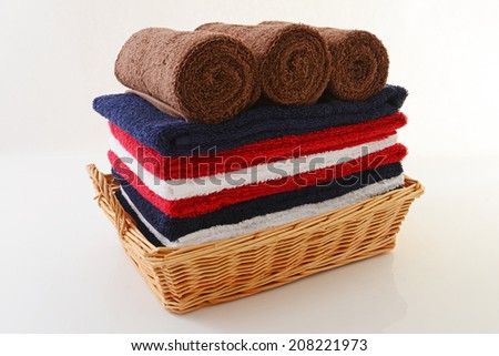Soft and fluffy rolled up cotton towels on white