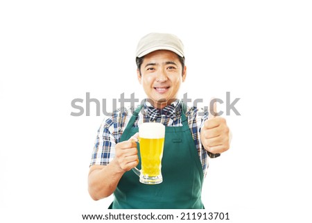 Smiling Asian waiter with beer