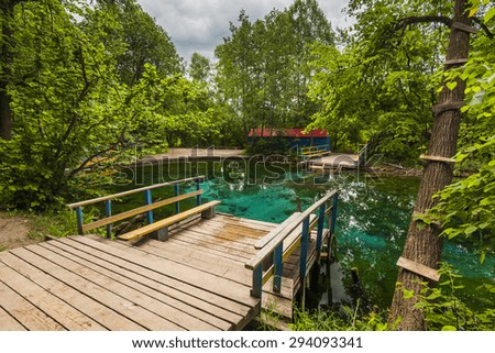 Beautiful views of the blue lake with wooden bridge.