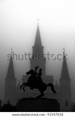 Statue with Church in background in New Orleans, Louisiana