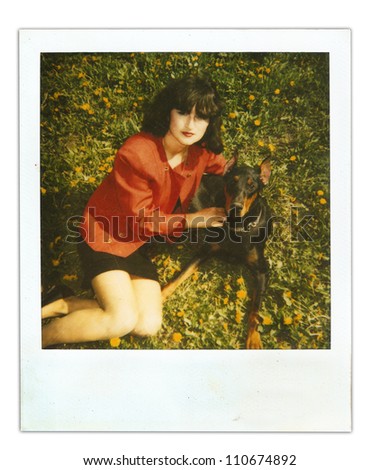 vintage photo girl with a dog Doberman (made to look old)