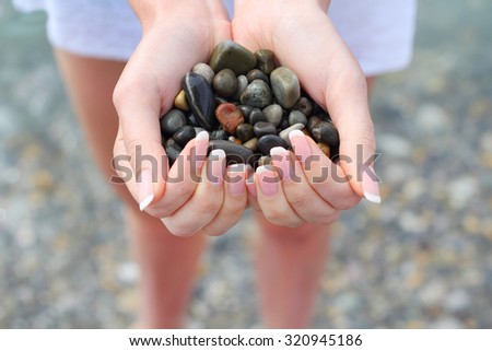 Sea stones in hand