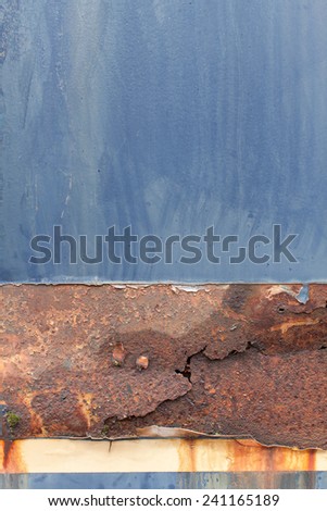 Blue steel metal with water erosion drip, yellow brown rust, color fade, crack and tears