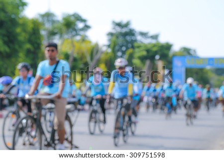 blurred people cycling together in the event BIKE FOR MOM
