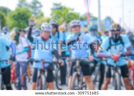blurred people cycling together in the event BIKE FOR MOM