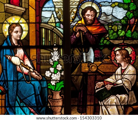 Stained glass window of Holy Family, Jesus, Mary and Joseph