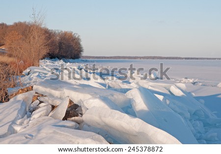 Winter landscape: Ice chunks along lake shore of Mille Lacs Lake in Minnesota