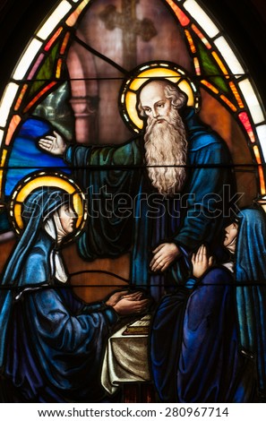 BRISTOW, VIRGINIA - APRIL 26, 2015: Stained glass window of Saint Benedict and his twin sister, St. Scholastica, located in chapel of St. Benedict Monastery