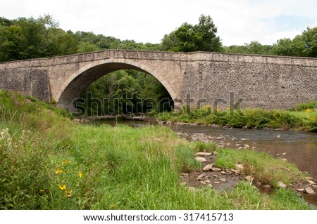 Casselman Bridge, a stone arch bridge built in 1813, located in Casselman River Bridge State Park, Garrett County, Maryland; a National Historic Landmark