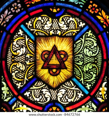 Stained Glass Window With Triangle And Circles Symbolizing The Holy ...