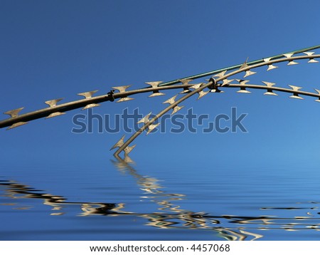 Close up of razor wire against a blue sky reflected in water.