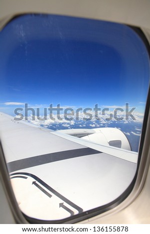 Clear and sky as seen through window of an aircraft
