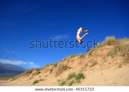 Similar – Jumping in Sand Dunes