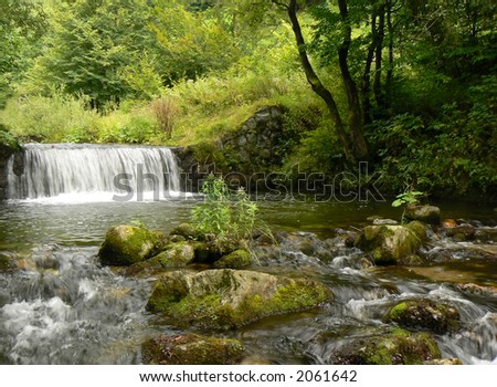 Mountain river stream. Waterfall.