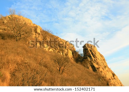 hilly areas of natural landscape in the blue sky