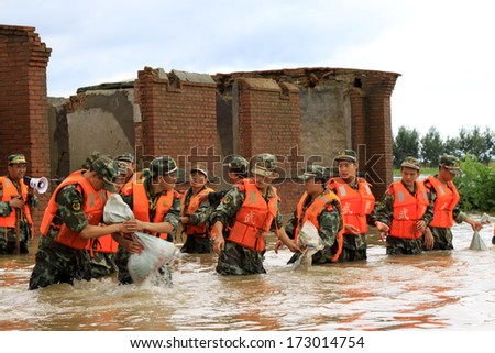 LUANNAN - AUGUST 4: Chinese armed police soldiers flood fighting and emergency rescues on August 4, 2012, Luannan, Hebei, China.