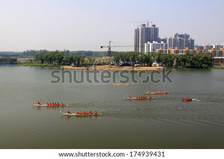 LUANNAN - JUNE 14: The dragon boat race scene in Chinese traditional Dragon Boat Festival on June 14, 2013, Luannan, Hebei Province, China.
