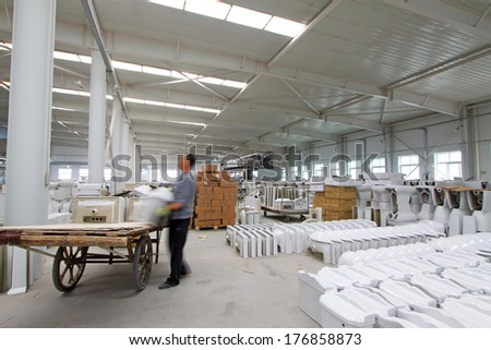 Luannan - October 25: Workers were carring ceramic semi finished products, in a ceramic products processing enterprises, in October 25, 2012, Luannan County, china.