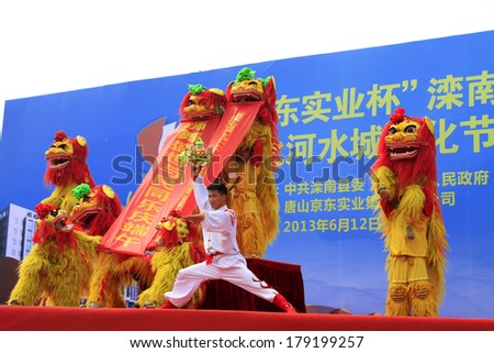 LUANNAN, CHINA - JUNE 12: Lion dance performance on the stage on JUNE 12, 2013, Luannan County, Hebei Province, china.