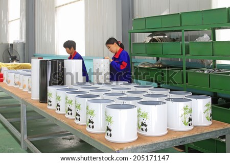LUANNAN COUNTY - MAY 27: Women workers working in a production workshop, on may 27, 2014, Luannan county, Hebei Province, China