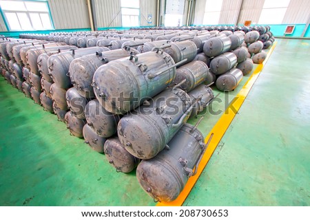 TANGSHAN CITY - MAY 28: Metal pressure tank piled up together in a production workshop, on may 28, 2014, Tangshan city, Hebei Province, China