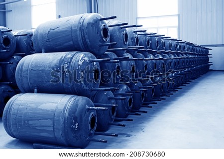 TANGSHAN CITY - MAY 28: Metal pressure tank piled up together in a production workshop, on may 28, 2014, Tangshan city, Hebei Province, China