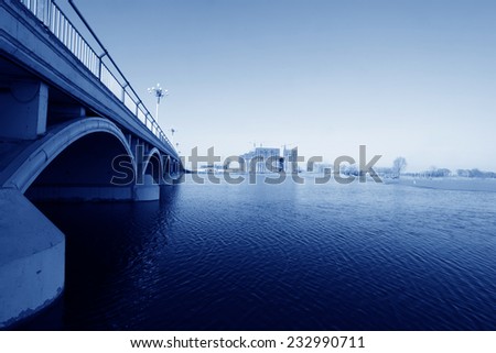 bridge and frozen river under the blue sky, north china