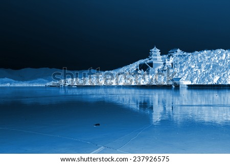 Tower of Buddhist incense and frozen Kunming lake in the Summer Palace on December 10, 2011, Beijing, china.