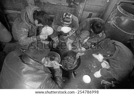 Luannan County, April 1: Workers were having lunch in the cabin of fishing boat in the ZuiDong fishing Wharf on April 1, 2012, Luannan County, Hebei Province, China.