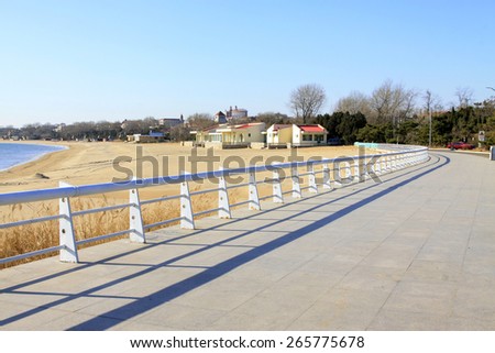 Coastal highway railings and buildings, closeup of photo