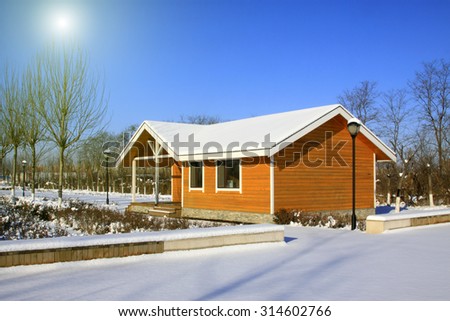 park cabin in the snow, closeup of photo