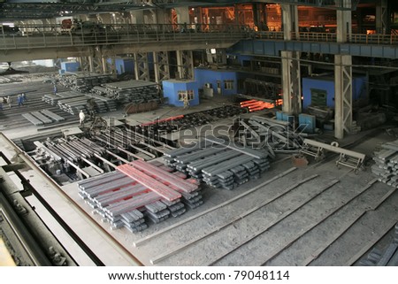 steel company production workshop in a factory, piles of steel ingot