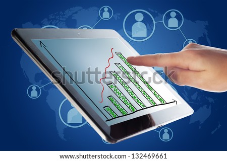 Tablet Computer with a diagram chart and a hand on blue background with world map