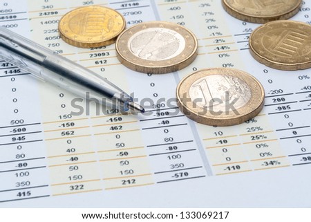 Business background, market analysis concept with financial data, pen and euro coins