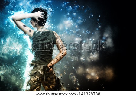 Artistic grunge effect portrait  of a Young female hero fighting and holding a gun and wearing camouflage clothes