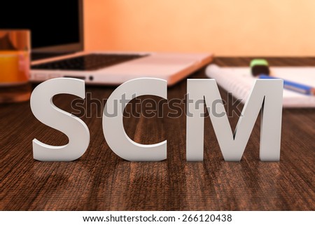 SCM - Supply Chain Management - letters on wooden desk with laptop computer and a notebook. 3d render illustration.