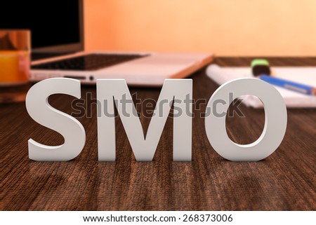 SMO - Social Media Optimization - letters on wooden desk with laptop computer and a notebook. 3d render illustration.