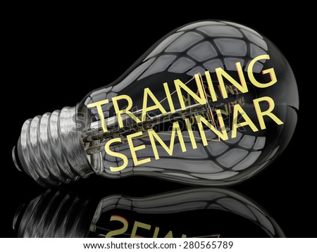 Training Seminar - lightbulb on black background with text in it. 3d render illustration.