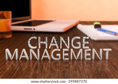 Change Management - letters on wooden desk with laptop computer and a notebook. 3d render illustration.