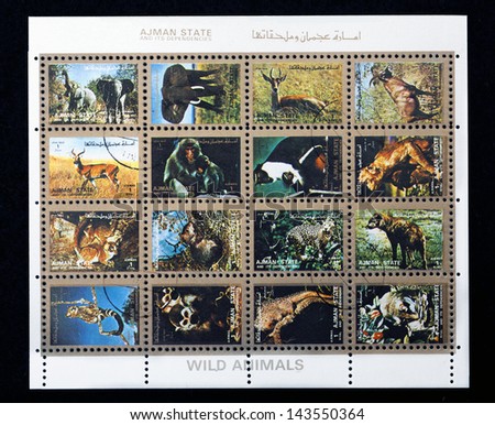 AJMAN- CIRCA 1973: A collection of sixteen stamps showing pictures of endangered wild animals, circa 1973