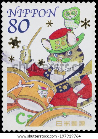 JAPAN - CIRCA 2005: A stamp printed in Japan shows a tiger playing drums and sending  Christmas greeting, circa 2005