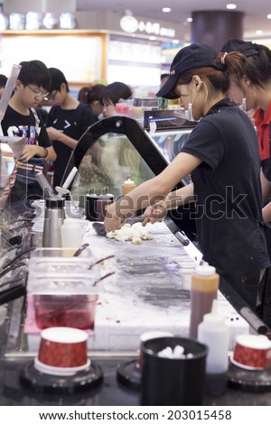 TAIPEI, TAIWAN - JULY 5: Ice Cream shop at a shopping mall on July 5, 2014, Taipei, Taiwan.  East Taipei has many large department stores. It is one of the best place to go and shop.