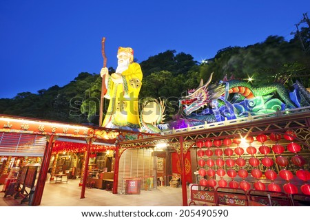 TAIPE, TAIWAN-JULY 14: Hunglodei Temple at night. It\'s one of the oldest temple in Taiwan on July 14, 2014. It has the largest status of Tudi Gong, the God of the earth in Taiwan (109 meters tall)