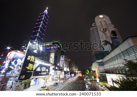TAIPEI, TAIWAN - DECEMBER 21: Raining Night at Taipei modern city street at Xinyi financial district on December 21, 2014. It is one of the latest modern district in Taipei with Taipei 101 near by