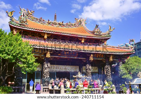 TAIPEI, TAIWAN - DECEMBER 5TH : Many people including tourist and believers come to Longshan Temple, Taiwan on December 5th, 2014. It is one of the oldest Traditional Temple in Taipei