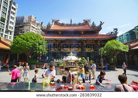 TAIPEI, TAIWAN - June 2, 2015: LongShan Temple on June 2, 2015. LongShan is one of the oldest and famous sacred temple at Taipei, Taiwan for local people and tourist.